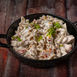 Veg Pasta in White Cheesy Sauce